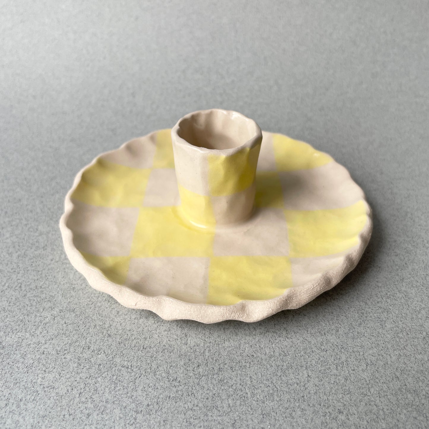 yellow checkered candle holder